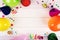 birthday party items on white wooden background