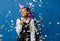 Birthday party, new year carnival. Young smiling african woman on blue background celebrating brightful event, wears