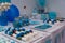 Birthday sailor-themed table setting with sweet decorations and a sailor figurine