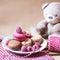 Birthday surprise: festive breakfast with french traditional macaroons and a teddy bear