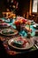 birthday table setting with plates, napkins, and party favors