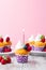 Birthday vanilla cupcakes with fresh raspberries