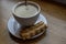 Biscuit bliss: indulging in a hot cappuccino