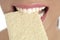 Biscuit in woman teeth and mouth, healthy snack