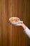 Biscuits with condensed milk in a white plate, closeup. Waiter serves nut cookies with condensed milk. Eating out