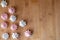 Biscuits meringue white and rose round rotation a wooden table. Copy space.