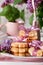 Biscuits with pink ribbon,lilac flowers and chocolate milkshake