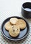 Biscuits on plate with coffee