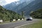 Bishkek, Kyrgyzstan - MAY 22, 2023: Road in Kyrgyzstan mountains with BMW X6 car