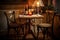 bistro table with mismatched chairs, candle and glasses of wine