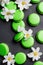 A bit floating lime green macarons and white flowers