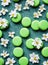 A bit floating lime green macarons and white flowers