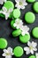 A bit floating lime green macarons and white flowers