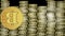 Bitcoin animation, golden cryptocurrency coin symbol moving on background composed of golden coin columns