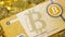 Bitcoin Banknote above Gold Bitcoins and Litecoin