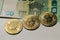 Bitcoin on banknotes of one hundred euro. Exchange euro for bitcoin. Cryptocurrency on euro bills. Digital modern method