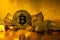 Bitcoin of the black background,  on Golden nugget gold background. Finance concept