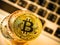 Bitcoin on blurred laptop. Virtual currency wallet bitcoin gold