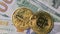 Bitcoin BTC coin rotate on 100 dollars bills. blockchain, mining GPU
