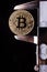 Bitcoin and calibre on black background - cryptocurrency