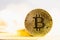 Bitcoin close-up on shining bright background