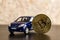 Bitcoin coin and auto. Cryptocurrency economy money.