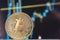 Bitcoin coin on a background of close-up graphics. The concept of a rising or falling trend, cryptocurrency news