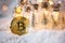 Bitcoin coin in the festive decor for Christmas and new year. Cryptocurrency, finance, wealth and investing. Fairy lights,