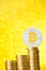 Bitcoin coin with golden bitcoin symbol on top of the coins stack stairs