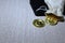 Bitcoin coin on a wooden table background. Cryptocurrency