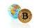 Bitcoin concept. World economy concept. New world currency. Golden coin bitcoin and globe