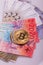 Bitcoin crypto currency coin over swiss francs bank notes