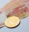 Bitcoin crypto currency coin on Russia Ruble banknotes