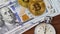 Bitcoin cryptocurrency BTC with stopwatch lies on dollars bills