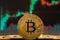 Bitcoin cryptocurrency gold coin. Trading on the cryptocurrency exchange. Trends in bitcoin exchange rates. Rise and fall charts