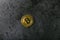 Bitcoin on dark marble. place for an inscription. gold coin bitcoin against the background of a dark stone