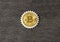 Bitcoin, gear on a wooden background.