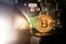 Bitcoin gold coin with blurry hard disk in the background