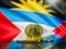 Bitcoin gold coin and defocused flag of Antigua and Barbuda background.