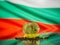 Bitcoin gold coin and defocused flag of Bulgaria background. Virtual cryptocurrency concept.