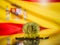 Bitcoin gold coin and defocused flag of Spain background. Virtual cryptocurrency concept.