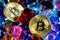 Bitcoin Gold coins strewn with various stones. Golden bitcoin cryptocurrency mining concept