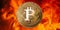 Bitcoin golden coin in front of flames