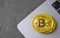Bitcoin golden coin on keyboard of laptop, symbol of digital currency cryptocurrency