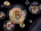 Bitcoin inside soap bubble on dark background.