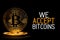 Bitcoin isolated on black with text WE ACCEPT BITCOINS