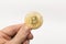 Bitcoin physical gold coin isolated on white