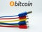 Bitcoin sign with different technological connector cables. New technological economy concept