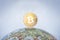 BITCOIN tag on the globe