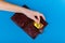 Bitcoin theft concept. A hand steals bitcoin from a wallet. Place for writing